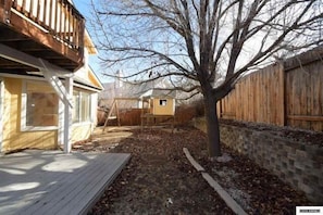 BACKYARD AND DECK WITH PLAYHOUSE FOR CHILDREN