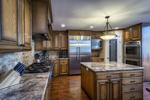 Kitchen is equipped with commercial grade appliances & all conveniences of home.
