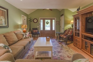 Living room facing west towards front door.