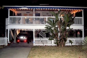 NIGHT VIEW OF HOUSE AND SCREENED PORCH