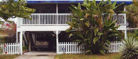 Front view of screened porch and parking