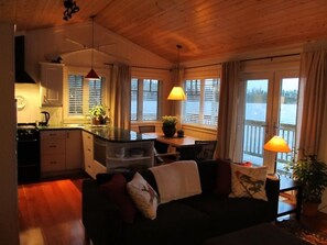 Cozy kitchen, dining and living area with plenty of windows with views
