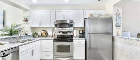 BRAND NEW KITCHEN! Everything NEW! Cabinets, granite, sink and all new Flooring 