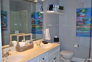 The master bath is bright and spacious.