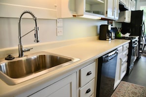 Stainless steel sink, full kitchen, and kitchen ware: pots/pans etc. Dishwasher