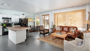 Lower level living space. Sliding door to courtyard.