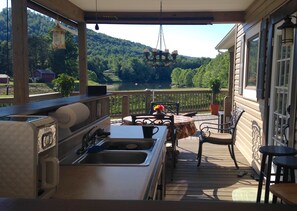 Outdoor kitchen area and deck.