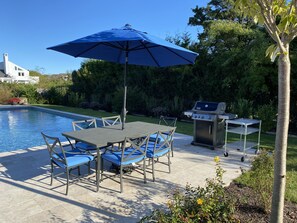 Restoration Hardware outdoor dining table for lunch or dinner next to the pool.