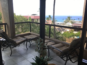 Wraparound lanai has a great view of the ocean. New Tropitone padded loungers!