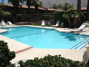 beautiful pool with seating area and patio furniture