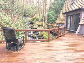 Large, private deck with water cascading in front and beneath