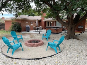 Great backyard with tons of options: firepit, horseshoes, grill, hot tub