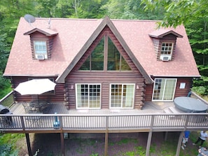 Drone Shot From The Front Of The Cabin With Deck Consisting Of BBQ And Hot Tub!