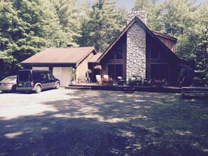 Nestled on 10 acres, this Chalet-style home offers a a bucolic respite