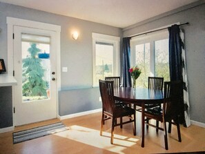 Eating area, with sliding doors to patio (right) and private entry door (left)