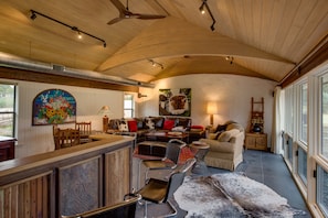 Arched beams and slate floors accent the Great Room at Casa Tejas.