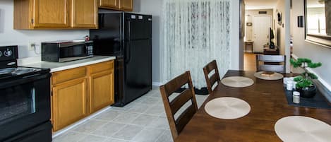 Spacious kitchen and dining area.  Full size stove and refrigerator.