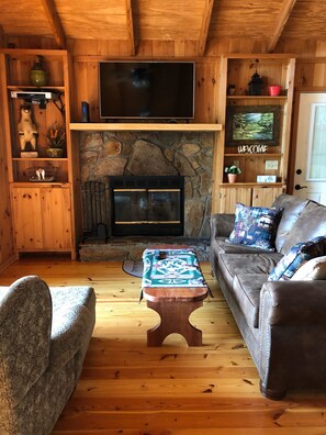 50” TV, wood burning fireplace, main floor living area with View. 