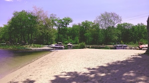 Sandy beach with shallow slope is perfect for kids to swim & play for hours.