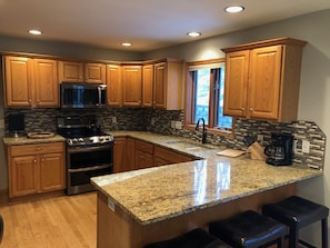 Fully equipped granite kitchen.