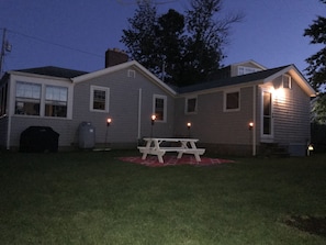 Private Backyard with picnic table, grill, and fire pit 