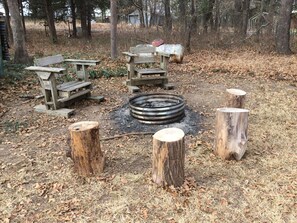 Light up a campfire with furnished firewood.