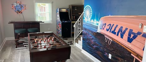 The whole family will enjoy the game room with mini bar
