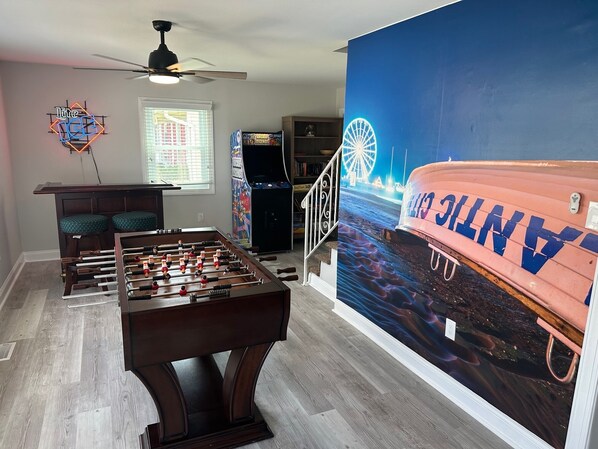 The whole family will enjoy the game room with mini bar