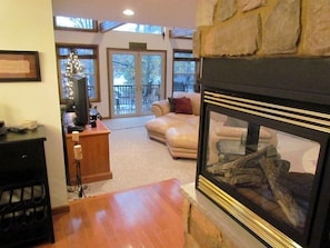 The 4-sided gas fireplace is the centerpiece of the great room and dining area.