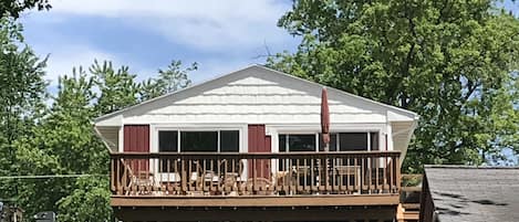 Cottage exterior on lake side with deck
