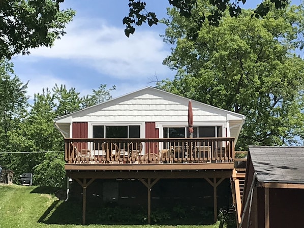 Cottage exterior on lake side with deck
