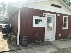 Front entrance and north side with grills.