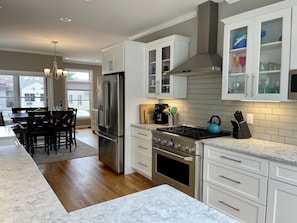 6 burner gas stove, stainless steel appliances, farm house sink.