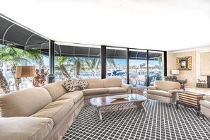 Like the whole of the house, the main living area features a mid century design with antiques and fine art throughout.
                