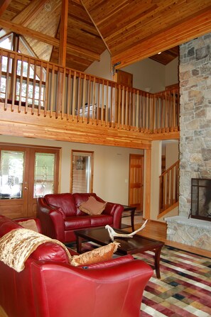 Balcony area has confortable seating for reading a book or watching a movie