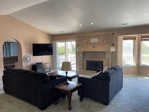 Living Room with gas fire place and TV