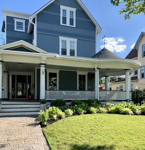 Large house with large front porch to watch the day go by on.