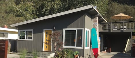 Front of house.  driveway accommodates two cars, in addition to carport