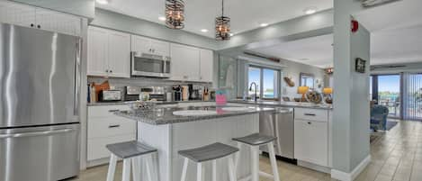 Entry to our condo with an open kitchen and plenty of counter space.