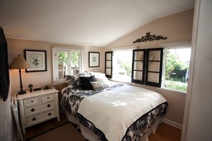 Master Bedroom with queen bed and mini view of ocean