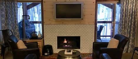 Living Room features a Gas Fireplace and a Vaulted Ceiling. 