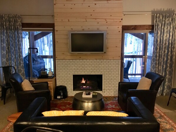 Living Room features a Gas Fireplace and a Vaulted Ceiling. 