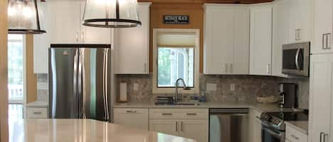 kitchen with large island (4 stools), pantry, stainless appliances