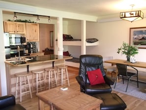 open kitchen, living area and bunk beds