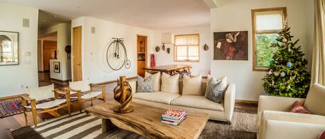 Living room with dining room in the background.