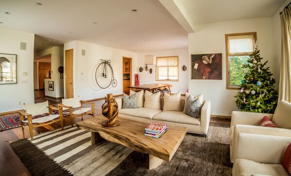 Living room with dining room in the background.