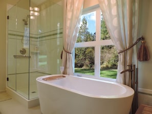 Huge master bath with a deep tub with view. 