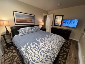 Master bedroom with King Bed and TV. Duvet covers are washed during every clean