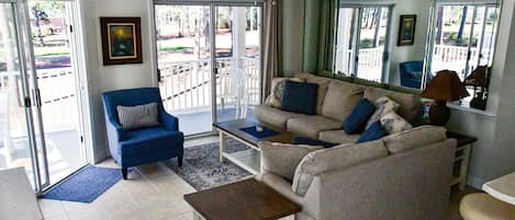 Villa living room with new pull out sectional, love seat, and side chair.