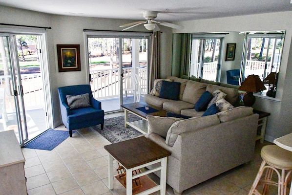 Villa living room with new pull out sectional, love seat, and side chair.